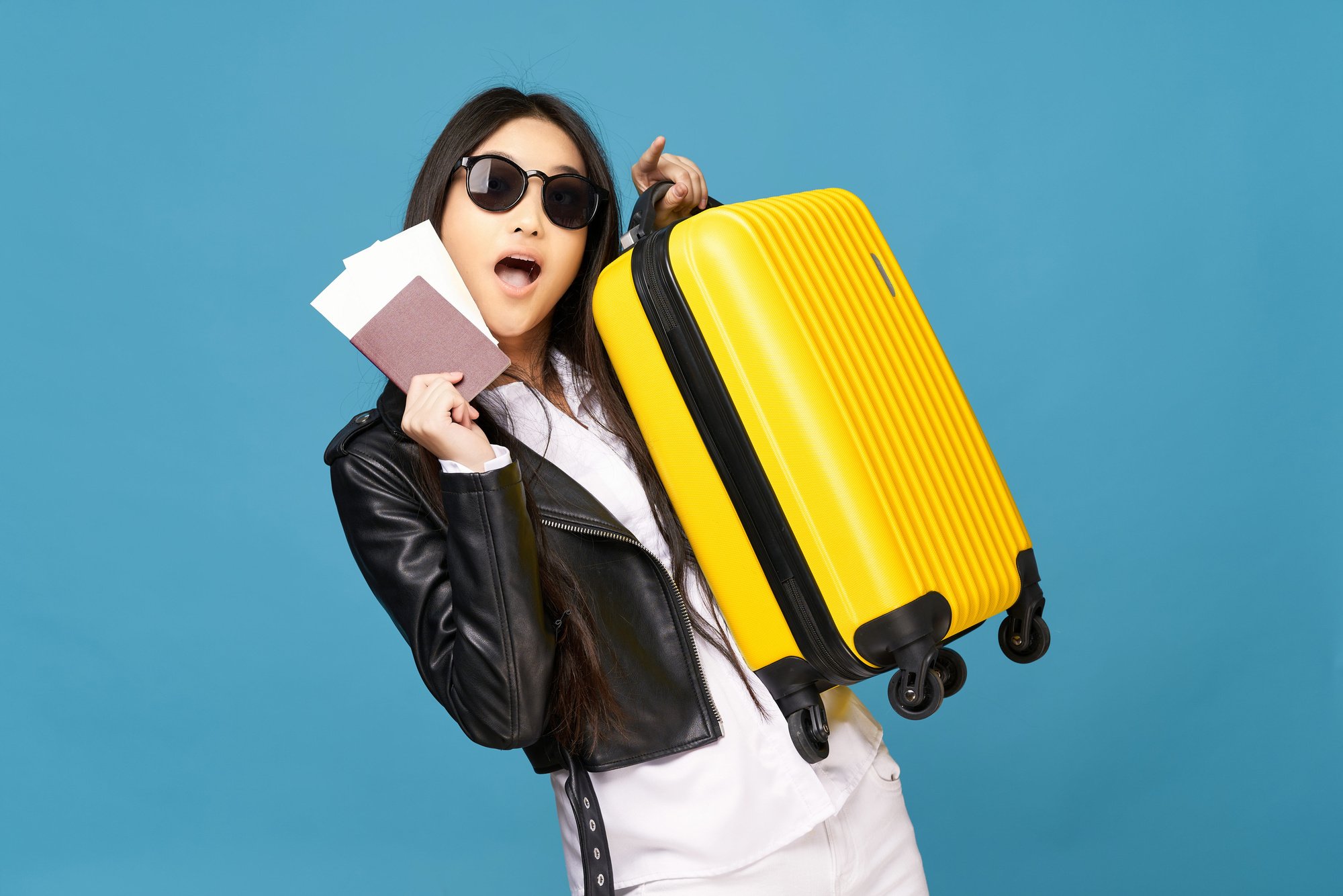 Young Woman Carrying Suitcase and Passport